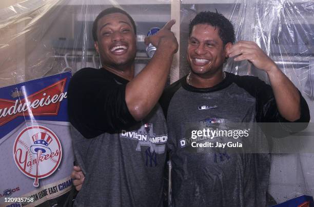 New York Yankees Robinson Cano and Bobby Abreu celebrate in their clubhouse after clinching their 9th consecutive American League East pennant . The...