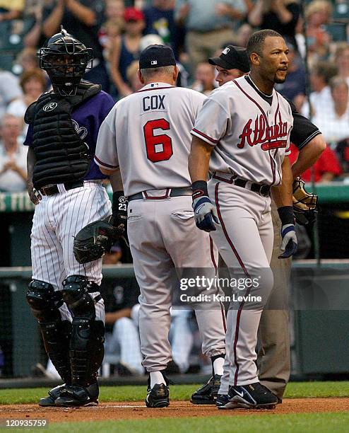 Atlanta Braves hitter Gary Sheffield walks away from home plate after he was ejected by home plate umpire Matt Hollowell in the first inning of the...