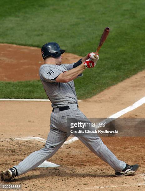Minnesota Twins' 1st Baseman, Justin Morneau, hitting a 2-run homer during the game against the Chicago White Sox July 26, 2006 at U.S. Cellular...