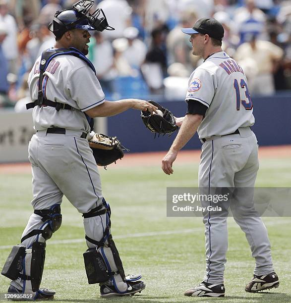 New York Mets Billy Wagner takes the ball from C Ramon Castro after earning his 15th save of the season in the Mets 7-4 victory vs the Toronto Blue...