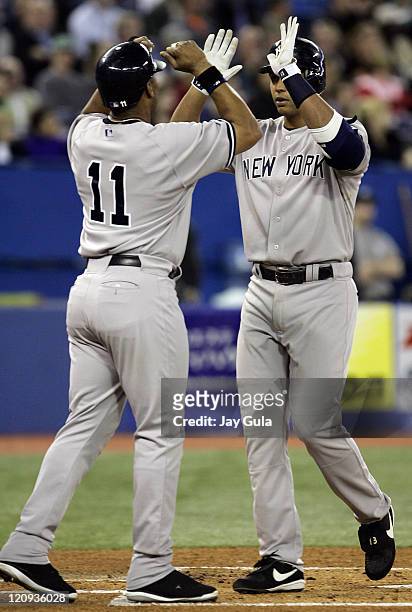 Yankees Gary Sheffield congratulates Alex Rodriguez after he slugged his 4th HR of the season during the New York Yankees vs Toronto Blue Jays game...