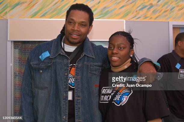 Legend, Sam Perkins and Nikki Teasley of the Los Angeles Sparks pose for a photo during a Read to Achieve Hospital Visit as part of 2004 NBA All Star...