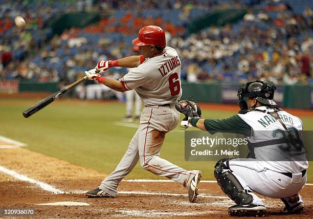 Los Angeles Angels infielder Maicer Izturis connects on this pitch during Wednesday's game against Tampa Bay at Tropicana Field in St. Petersburg,...