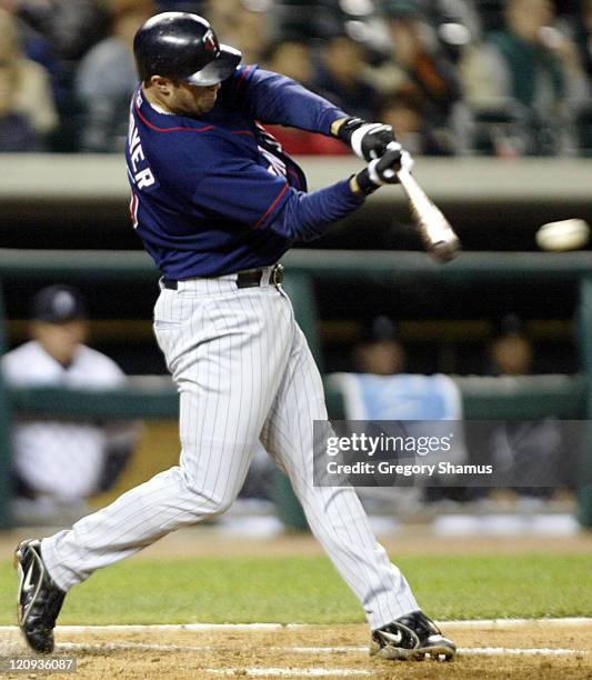 Minnesota Twins' Michael Cuddyer hits a single during 3rd inning action against the Detroit Tigers at Comerica Park, September 25, 2003. Detroit won...