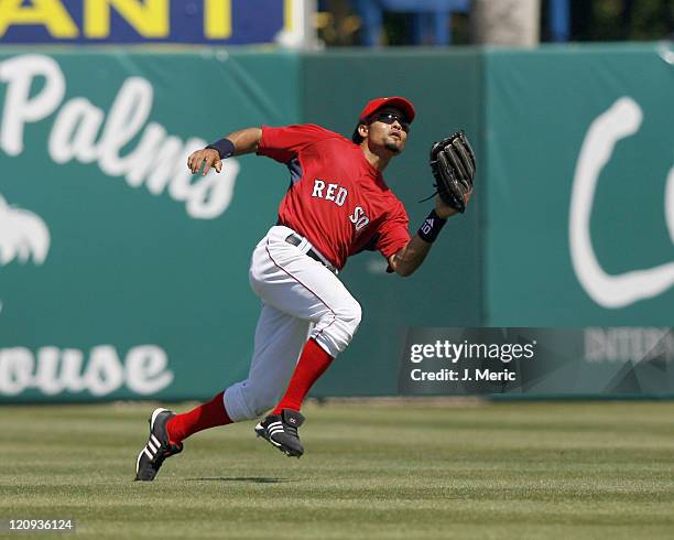 Boston center fielder Coco Crisp looks to make the play during Sunday's game against Florida at City of Palms Park in Ft. Myers, Florida on March 25,...