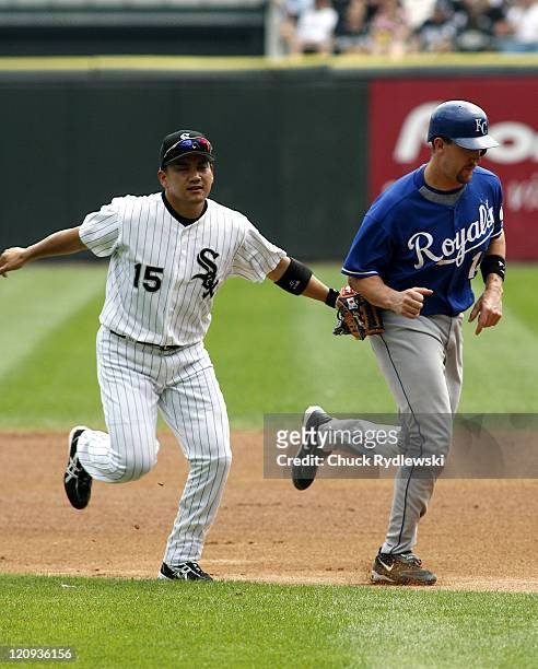 Chicago White Sox' 2nd Baseman, Tadahito Iguchi, tags out John Buck after a run-down during their game against the Kansas City Royals August 17, 2006...