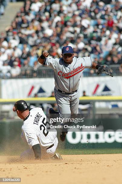 Cleveland Indians' 2nd Baseman, Ronnie Belliard, eludes Jim Thome and turns a double play during the game against the Chicago White Sox April 4, 2006...