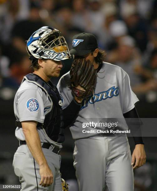 Toronto Blue Jay's starting battery, catcher, Gregg Zaun and pitcher, Scott Downs, go over strategy during their game against the Chicago White Sox...