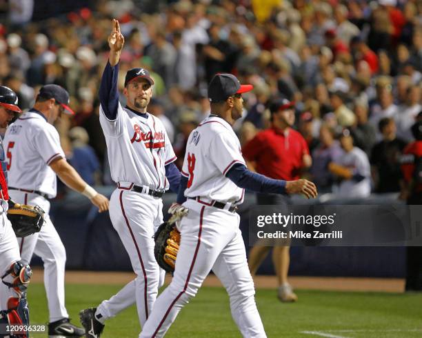 Atlanta Braves pitcher John Smoltz waves to the crowd after his complete game win against the Washington Nationals at Turner Field in Atlanta, GA on...