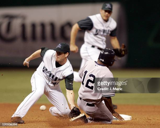 Tampa Bay's Nick Green prepares for the throw as New York's Tony Womack slides safely into second with a steal in Wednesday night's game at Tropicana...