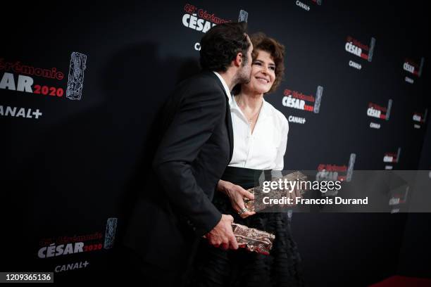 Nicolas Bedos and Fanny Ardant pose with their trophies respectively for Best Original Screenplay award and Best Actress in a Supporting Role award...