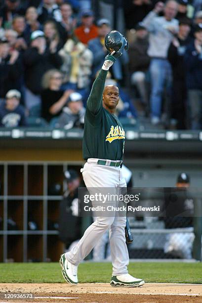 Oakland Athletics' DH and ex-White Sox, Frank Thomas, acknowledges the fans standing ovation prior to his first at bat during their game against the...