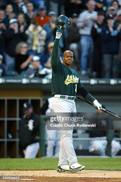 Oakland Athletics' DH and ex-White Sox, Frank Thomas, acknowledges the fans standing ovation prior to his first at bat during their game against the...