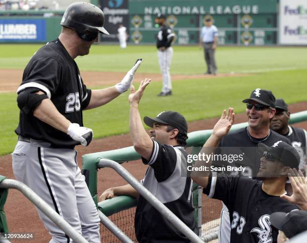 Chicago White Sox Jim Thome gets a high-five from Manager Ozzie Guillen after hitting a two run homer in the 8th inning against Pittsburgh at PNC...