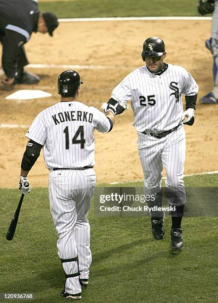 Chicago White Sox' DH, Jim Thome is greeted by teammate, Paul Konerko after his 3rd inning home run during their game versus the Texas Rangers April...