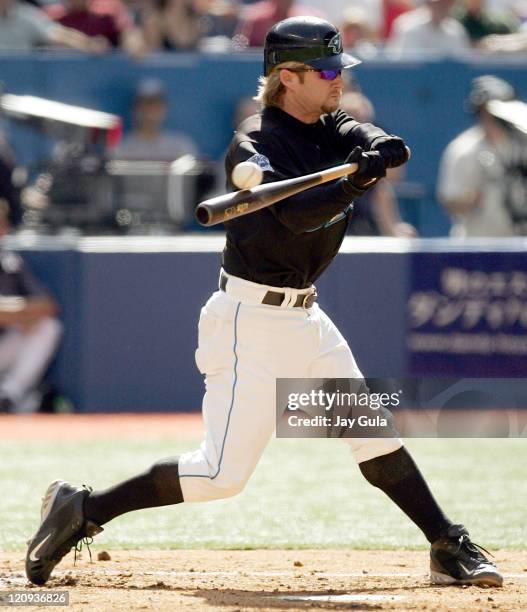 Catcher Greg Zaun of the Toronto Blue Jays fouls off a pitch during a game against the New York Yankees at the Rogers Centre in Toronto, Canada on...