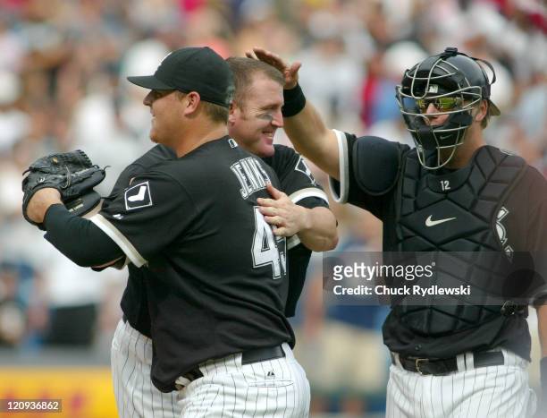 Chicago White Sox' Bobby Jenks, Jim Thome and A.J. Pierzynski celebrate their sweep of the three game series with the Detroit Tigers August 13, 2006...