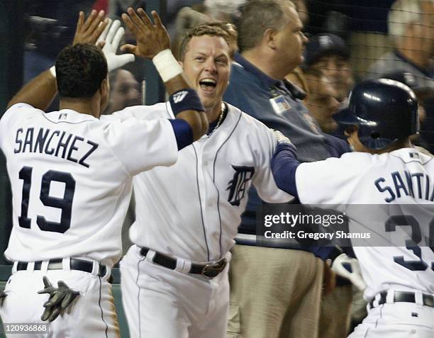 Detroit Tigers' Shane Halter celebrates with Alex Sanchez and Ramon Santiago after hitting the game winning home run against the Minnesota Twins in...