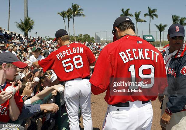 Boston pitchers Jonathan Papelbon and Josh Beckett sign autographs prior to Saturday's game against Toronto at City of Palms Park in Ft. Myers...
