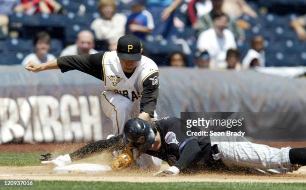 Arizona Diamondbacks Eric Byrnes is tagged out by Pittsburgh's Freddy Sanchez during action at PNC Park in Pittsburgh, Pennsylvania on June 19, 2006.
