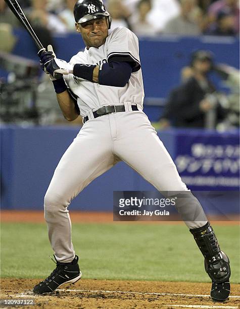 Derek Jeter winces after being grazed by a Dave Bush pitch in game against the Toronto Blue Jays at Rogers Centre in Toronto, Canada on September 16,...