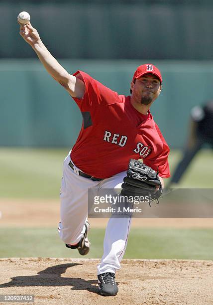 Boston starting pitcher Josh Beckett makes a pitch during Sunday's action against Florida at City of Palms Park in Ft. Myers, Florida on March 25,...