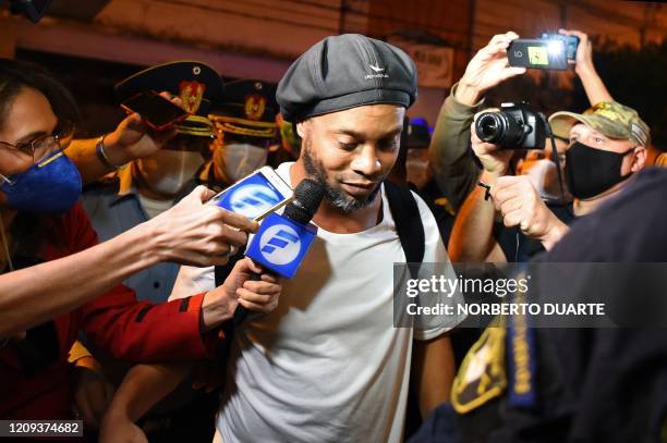 Brazilian retired football player Ronaldinho arrives at a hotel in Asuncion where he and his brother will serve house arrest after a judge ordered...