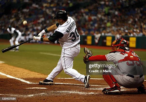 Tampa Bay's newly acquired catcher Dioner Navarro fouls off this pitch as Boston's Jason Varitek prepares to receive this pitch during Tuesday's game...