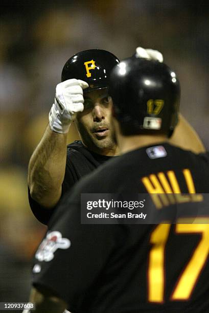 Pittsburgh Pirates Jack Wilson greets Bobby Hill as he crosses the plate during action against the Chicago Cubs at PNC Park in Pittsburgh,...