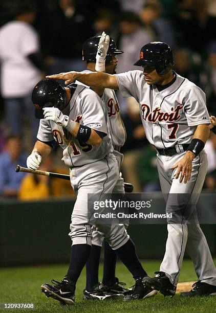 Detroit Tigers' Catcher, Ivan Rodriguez, gives Brandon Inge a pat on the head after Inge's 3-run homer in the 9th inning of their game against the...