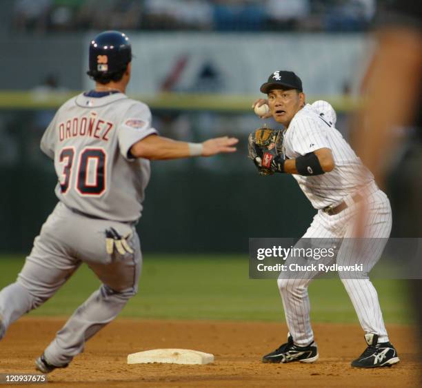 Chicago White Sox 2nd Baseman, Tadahito Iguchi, turns a double play during the game against the Detroit Tigers July 18, 2005 at U.S. Cellular Field...