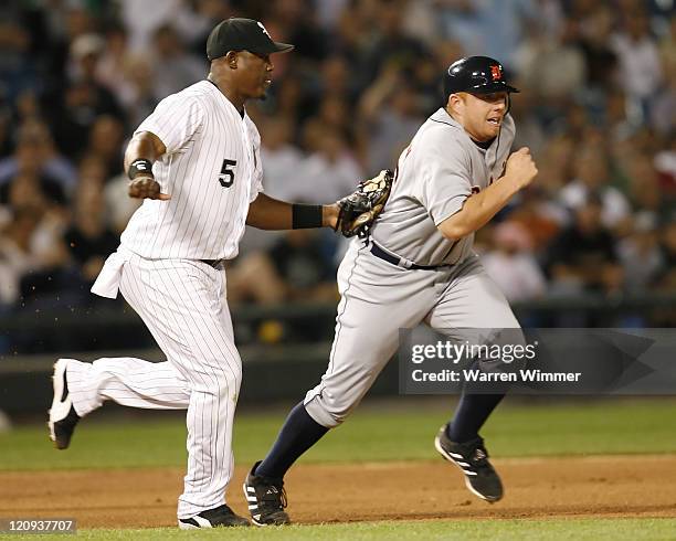 Chris Shelton, first baseman of the Detroit Tigers is tagged out during a rundown during the 9th inning at US Cellular Field, Chicago, Il. Thursday,...