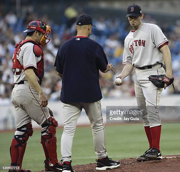 Boston Red Sox P Matt Clement hands the ball to Manager Terry Francona after giving up 6 runs in less than 4 innings during tonight's game vs the...