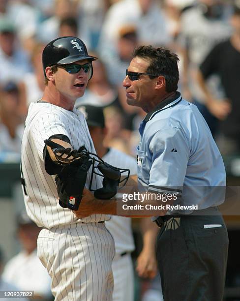 Chicago White Sox 3rd Baseman, Joe Crede and Home Plate Umpire, Angel Hernandez, have a heated exchange during the Interleague game against the...