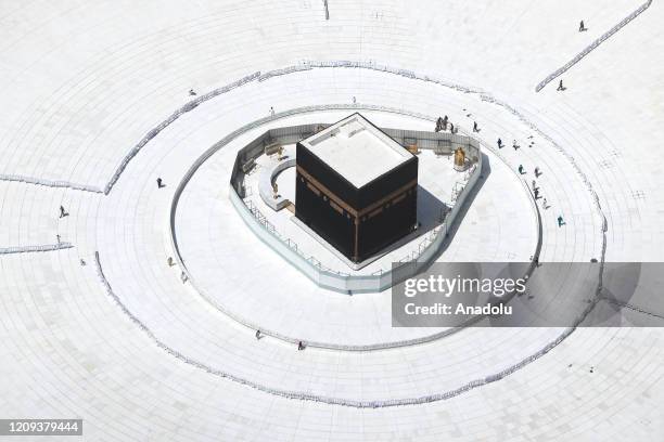 Few workers are seen nearby empty Kaaba after the precautions against the novel coronavirus are taken in Mecca, Saudi Arabia on April 07, 2020....