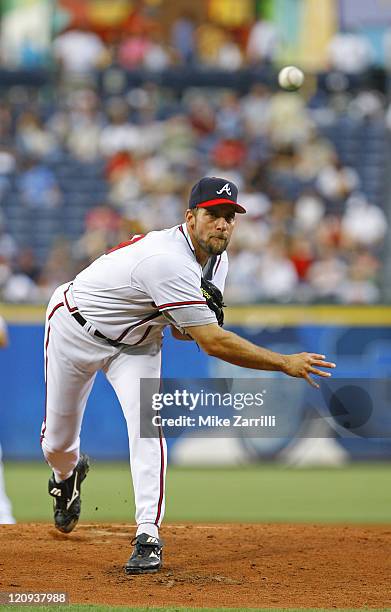 Atlanta Braves P John Smoltz delivers a pitch during the game between the Atlanta Braves and the Florida Marlins at Turner Field in Atlanta, GA on...