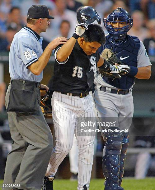 Chicago White Sox second baseman Tadahito Iguchi walks to first base after being hit in the head with a pitch during a game against the Seattle...