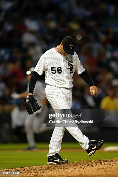 Chicago White Sox' Starter, Mark Buehrle, paws the dirt after giving up a 3-run homer to the Texas Rangers' Michael Young during the game against the...