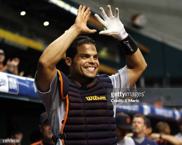 Detroit's Ivan Rodriguez awaits his teammate after a homer during Tuesday night's action against Tampa Bay at Tropicana Field in St. Petersburg,...