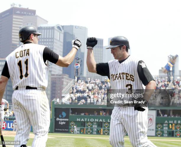 Pittsburgh Pirates Rob Mackowiak celebrates with teammate Humberto Cota following his two run homerun in the 6th against the Atlanta Braves on June...