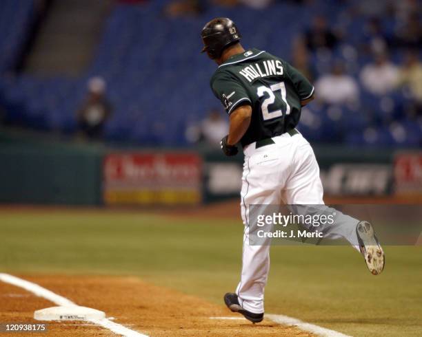 Tampa Bay's Damon Hollins rounds first after his first inning home run during Wednesday night's game against Toronto at Tropicana Field in St....