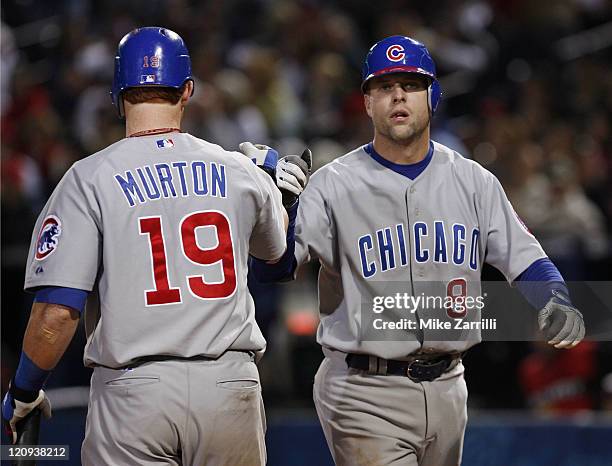 Chicago outfielder Matt Murton congratulates catcher Michael Barrett after Barrett's home run during the game between the Atlanta Braves and the...