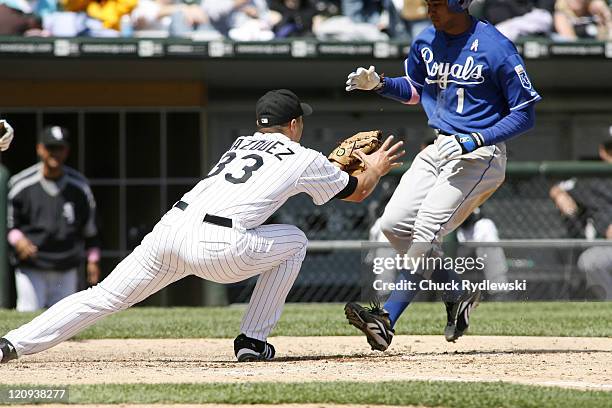 Chicago White Sox' Starter, Javier Vazquez tags out Tony Pena Jr. Trying to score on a wild pitch during their game versus the Kansas City Royals May...