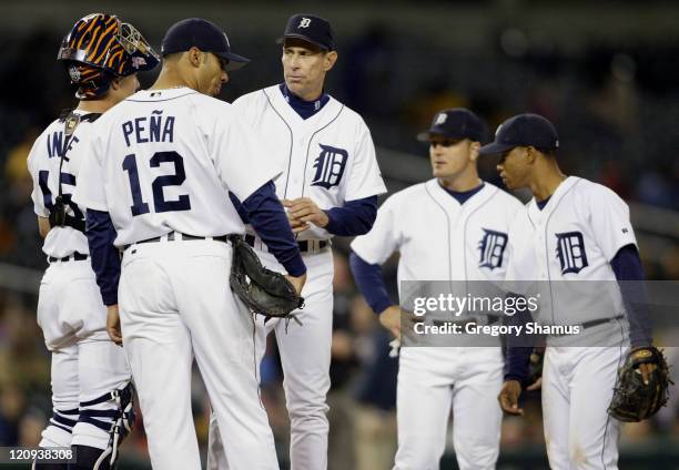 Detroit Tigers' manager Allen Trammell waits for a new pitcher with his infield during eighth inning action against the Minnesota Twins in at...