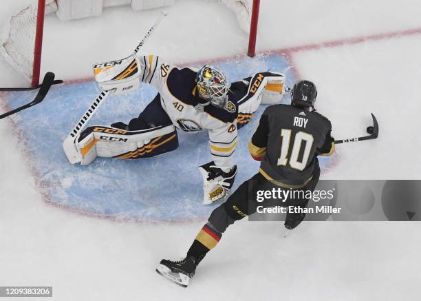 Nicolas Roy of the Vegas Golden Knights scores a first-period goal against Carter Hutton of the Buffalo Sabres during their game at T-Mobile Arena on...