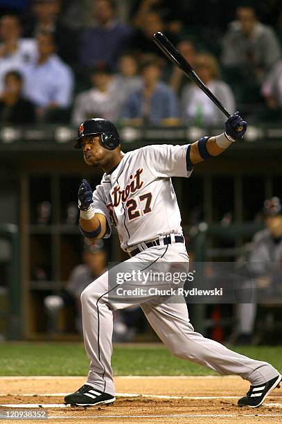 Detroit Tigers' leftfielder, Craig Monroe, follows through on his 1st inning 2-run home run during their game against the Chicago White Sox September...