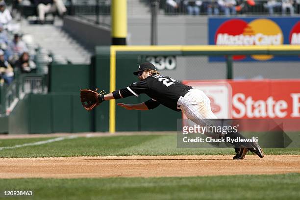 Chicago White Sox 3rd Baseman, Joe Crede, dives but can't come up with Jhonny Peralta's single during their game against the Cleveland Indians, April...