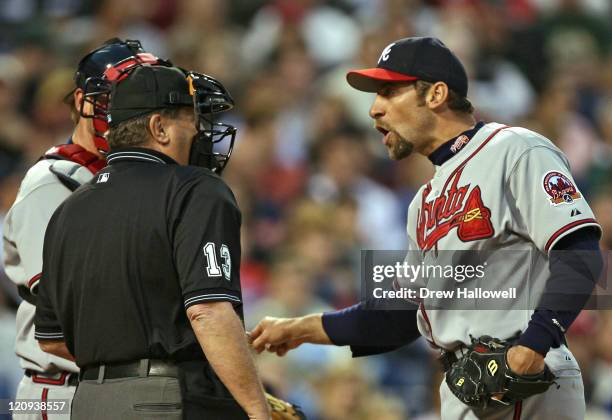 Atlanta Braves pitcher John Smoltz argues with home plate umpire Tim Timmons after hitting Phillies batter Jimmy Rollins Wednesday, May 3, 2006 at...