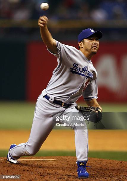 Los Angeles Dodgers relief pitcher Takashi Saito makes a pitch against the Tampa Bay Devil Rays on Friday night at Tropicana Field in St. Petersburg,...