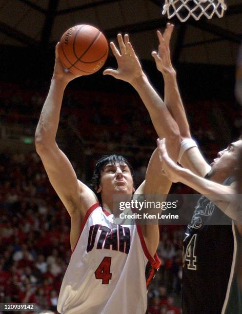 Andrew Bogut, of Utah, scores against Matt Nelson, of Colorado State at the Jon Huntsman Center in Salt Lake City, Utah Feb. 12, 2005. Utah defeated...